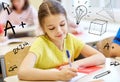 Group of school kids writing test in classroom Royalty Free Stock Photo