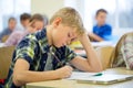 Group of school kids writing test in classroom Royalty Free Stock Photo