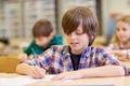 Group of school kids writing test in classroom Royalty Free Stock Photo