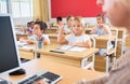 Group of school pupils raise their hands up Royalty Free Stock Photo