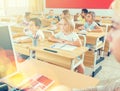 Group of school pupils raise their hands up Royalty Free Stock Photo