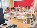 Group of school pupils raise their hands up Royalty Free Stock Photo