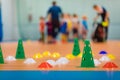 Group of school sports equipment on wooden floor. School children training soccer at indoor soccer field