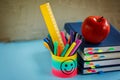 Group of school supplies and books and red apple over on backgro Royalty Free Stock Photo