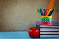 Group of school supplies and books and red apple over on backgro Royalty Free Stock Photo