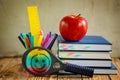 Group of school supplies and books and red apple over on backgro Royalty Free Stock Photo