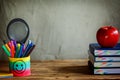 Group of school supplies and books and red apple over on background.School, stationary, equipment. Royalty Free Stock Photo