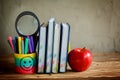 Group of school supplies and books and red apple over on background.School, stationary, equipment. Royalty Free Stock Photo