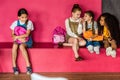 group of schoolgirls laughing and gossiping on their classmate Royalty Free Stock Photo