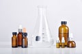 Group of scientific laboratory glassware with medicine bottles and clear liquid solution, Drug research Royalty Free Stock Photo
