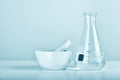 Group of scientific laboratory glassware and mortar with clear liquid solution, Research Royalty Free Stock Photo