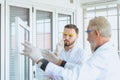 Group of scientist explaining research information together in the laboratary Royalty Free Stock Photo