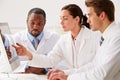 Group Of Scientists Checking Laboratory Results On Computer Royalty Free Stock Photo