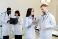 Group of scientists examining data on paper Royalty Free Stock Photo