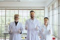 Group of scientists people standing and showing thumb up together in laboratory,Successful teamwork and research working Royalty Free Stock Photo