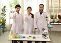 The group of scientists smiled and expressed their delight at the success. in modern laboratories. Royalty Free Stock Photo