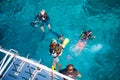 Group of scuba divers with equipment before diving at Similan Ma