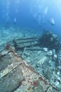 Group of scuba divers exploring a shipwreck. Royalty Free Stock Photo