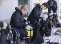 A group of scuba divers kitting up