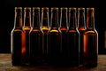 Group of sealed unlabelled brown beer bottles
