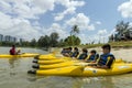 Group of secondary school children learn kayaking at Singapore river.