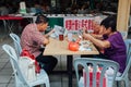 Group of senior Chinese people having a breakfast in traditional