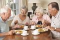 Group Of Senior Couples Enjoying Meal Together