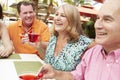 Group Of Senior Friends Enjoying Cocktails In Bar Together Royalty Free Stock Photo