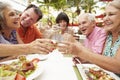 Group Of Senior Friends Enjoying Meal In Outdoor Restaurant Royalty Free Stock Photo