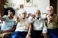 Group of senior friends gesturing thumbs down sign Royalty Free Stock Photo