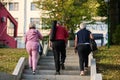 A group of senior friends takes a well-deserved break in nature, fostering not only fitness but also camaraderie and a Royalty Free Stock Photo