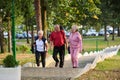 A group of senior friends takes a well-deserved break in nature, fostering not only fitness but also camaraderie and a Royalty Free Stock Photo