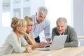 Group of senior friends using laptop Royalty Free Stock Photo