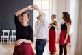 Group of senior people in dancing class with dance teacher. Royalty Free Stock Photo
