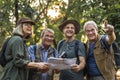 Group of senior trekkers checking a map for direction Royalty Free Stock Photo