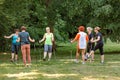 Group of Senior women doing a series of warm-up exercises with walking poles before nordic walking Royalty Free Stock Photo