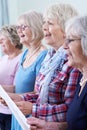 Group Of Senior Women Singing In Choir Together