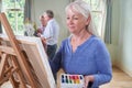 Group Of Seniors Attending Painting Class With Teacher Royalty Free Stock Photo