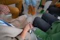 Group of seniors holding hands and praying for Ukraine together in church community center, close-up. Royalty Free Stock Photo