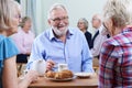 Group Of Seniors Meeting At Social Club