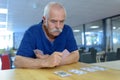 Group seniors playing cards in retirement house Royalty Free Stock Photo