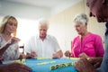 Group of seniors playing dominoes Royalty Free Stock Photo