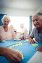Group of seniors playing dominoes Royalty Free Stock Photo