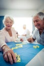 Group of seniors playing dominoes Royalty Free Stock Photo