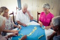 Group of seniors playing dominoes Royalty Free Stock Photo