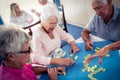 Group of seniors playing dominoes Royalty Free Stock Photo