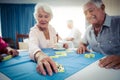 Group of seniors playing dominoes Royalty Free Stock Photo