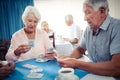 Group of seniors playing dominoes Royalty Free Stock Photo