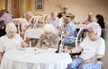 Group Of Seniors Playing Game Of Bingo In Retirement Home Royalty Free Stock Photo