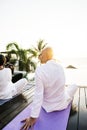 Group of seniors practicing yoga in the morning Royalty Free Stock Photo